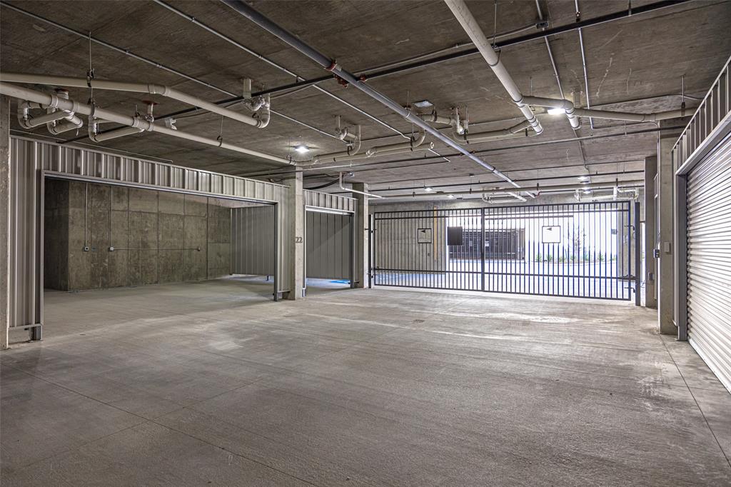 340 O O Connor Ridge Boulevard, Unit 13 Irving, TX 75038 - Photo 32 of 35 ENCLOSED 3-CAR GARAGE INCLUDED WITH EACH CONDO.Photo of Villa Two Garage-Villa Five is under construction