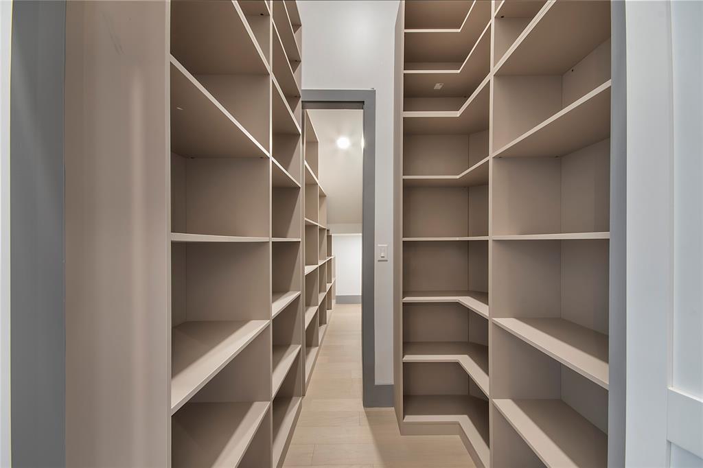 421 Sunrise Ridge Drive Heath, TX 75032 - Photo 17 of 39 a view of closet with empty racks
