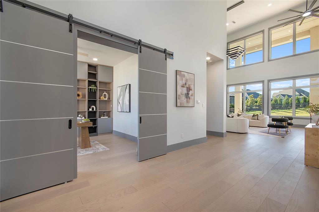 421 Sunrise Ridge Drive Heath, TX 75032 - Photo 22 of 39 a view of empty room with windows and entryway