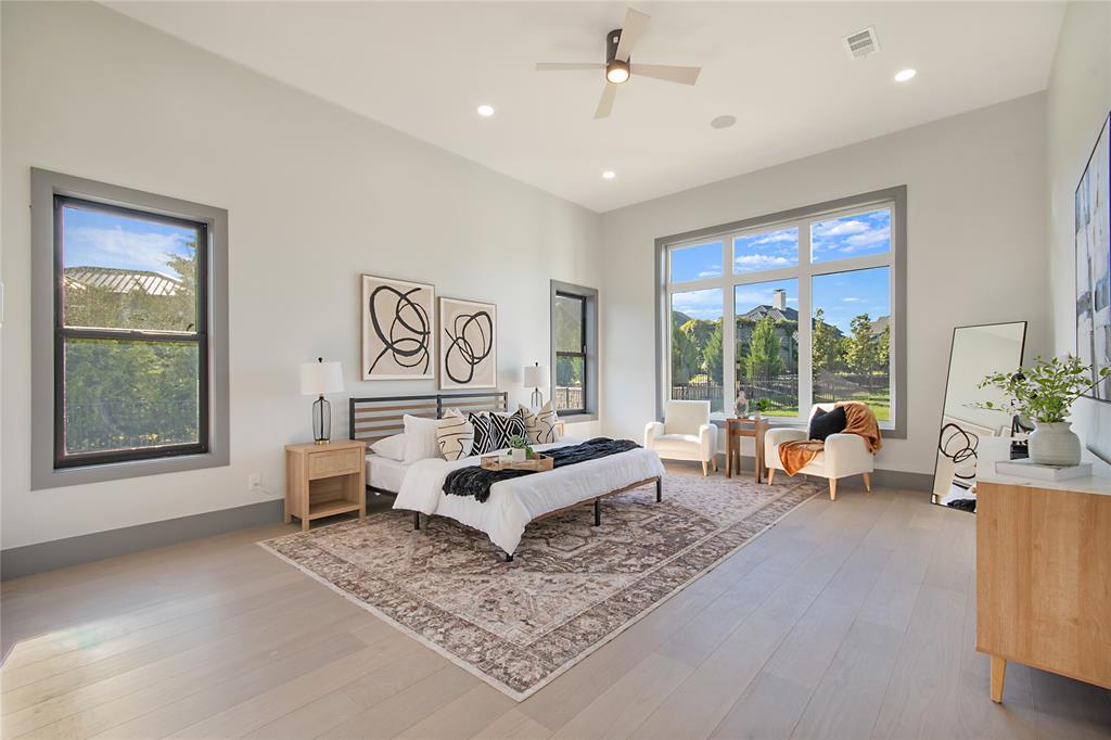 421 Sunrise Ridge Drive Heath, TX 75032 - Photo 24 of 39 a bed room with furniture and a window