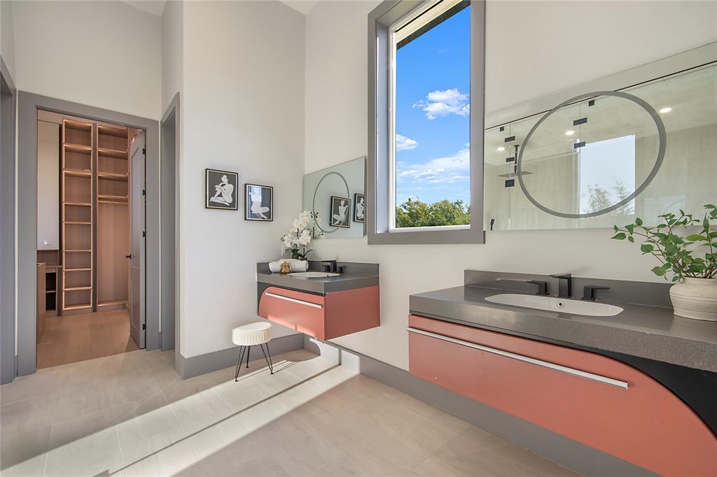 421 Sunrise Ridge Drive Heath, TX 75032 - Photo 25 of 39 a bathroom with a granite countertop sink and a mirror