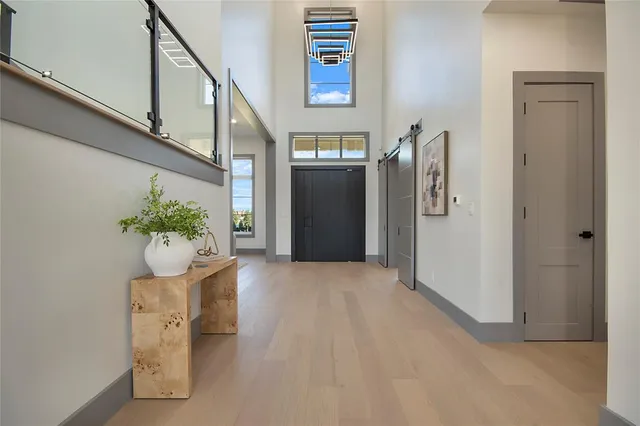 a room with furniture and a projector screen