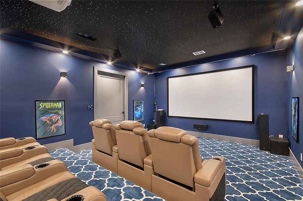 421 Sunrise Ridge Drive Heath, TX 75032 - Photo 29 of 39 a room with furniture and a projector screen