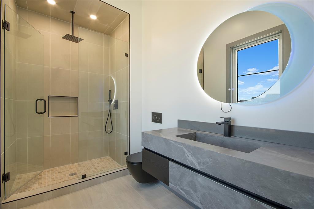 421 Sunrise Ridge Drive Heath, TX 75032 - Photo 33 of 39 a bathroom with a sink and a mirror