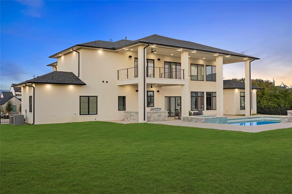 421 Sunrise Ridge Drive Heath, TX 75032 - Photo 36 of 39 a front view of a house with a yard