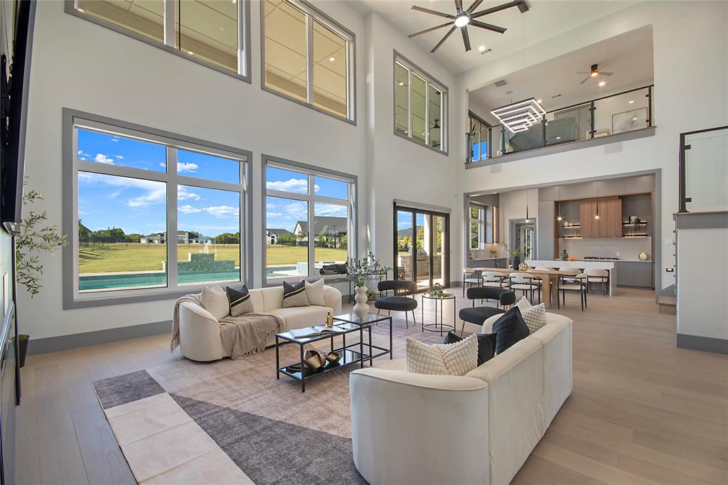 421 Sunrise Ridge Drive Heath, TX 75032 - Photo 10 of 39 a living room with furniture and a large window