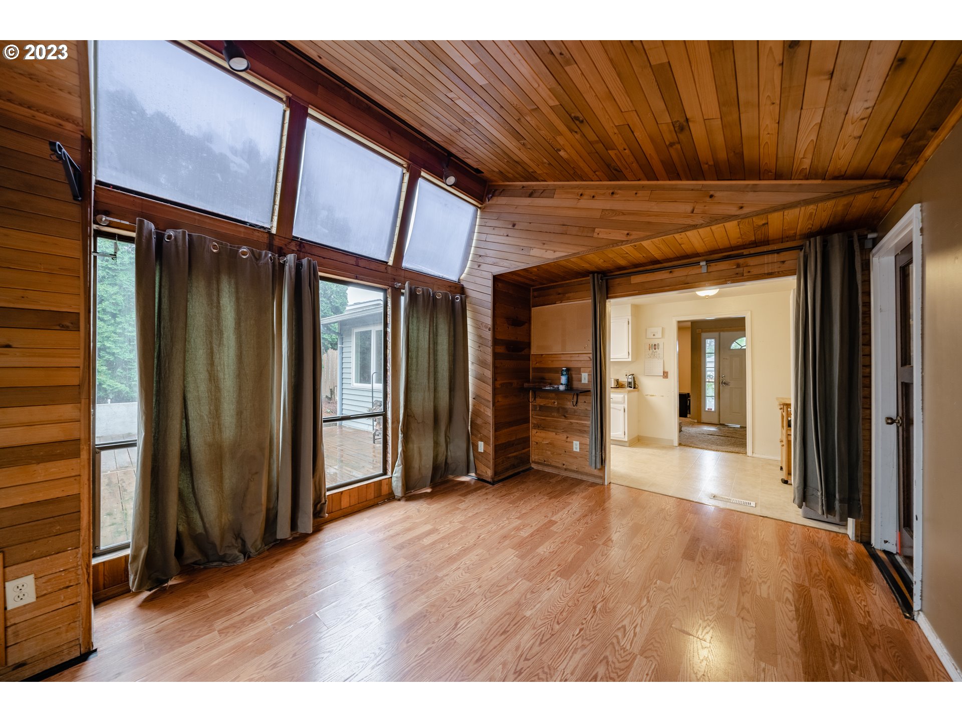 1857 Southwest 5th Street Gresham, OR 97080 - Photo 17 of 40 a view of an empty room with wooden floor and a window