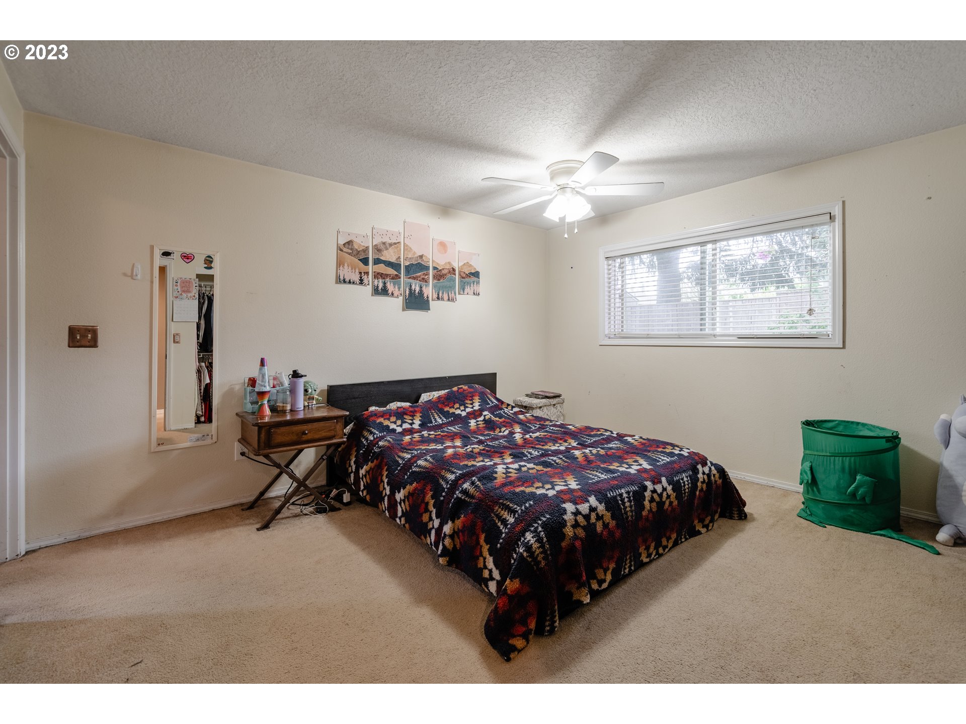 1857 Southwest 5th Street Gresham, OR 97080 - Photo 18 of 40 a bed sitting in a bedroom next to a window