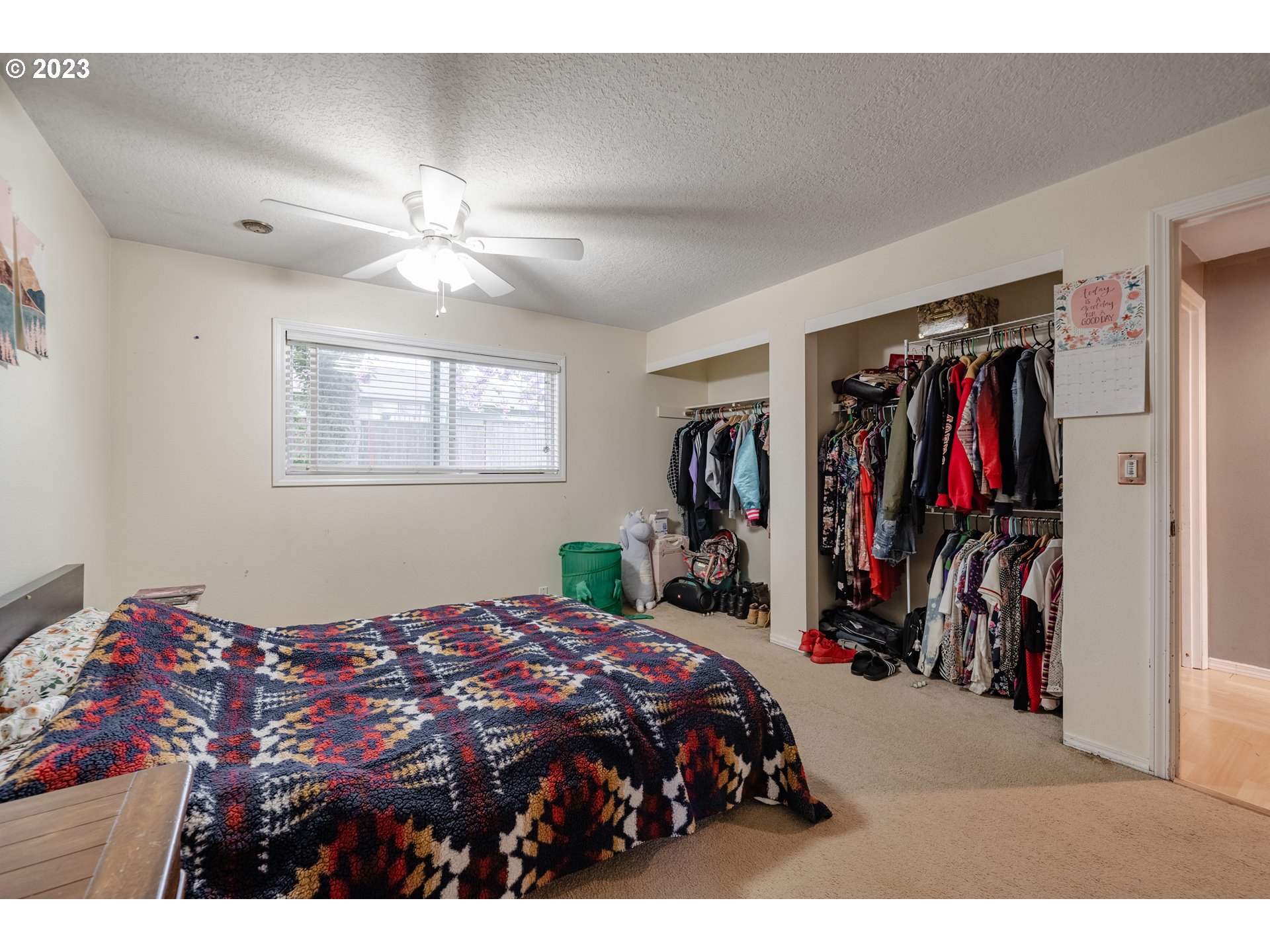 1857 Southwest 5th Street Gresham, OR 97080 - Photo 19 of 40 a bedroom with a bed and a chandelier