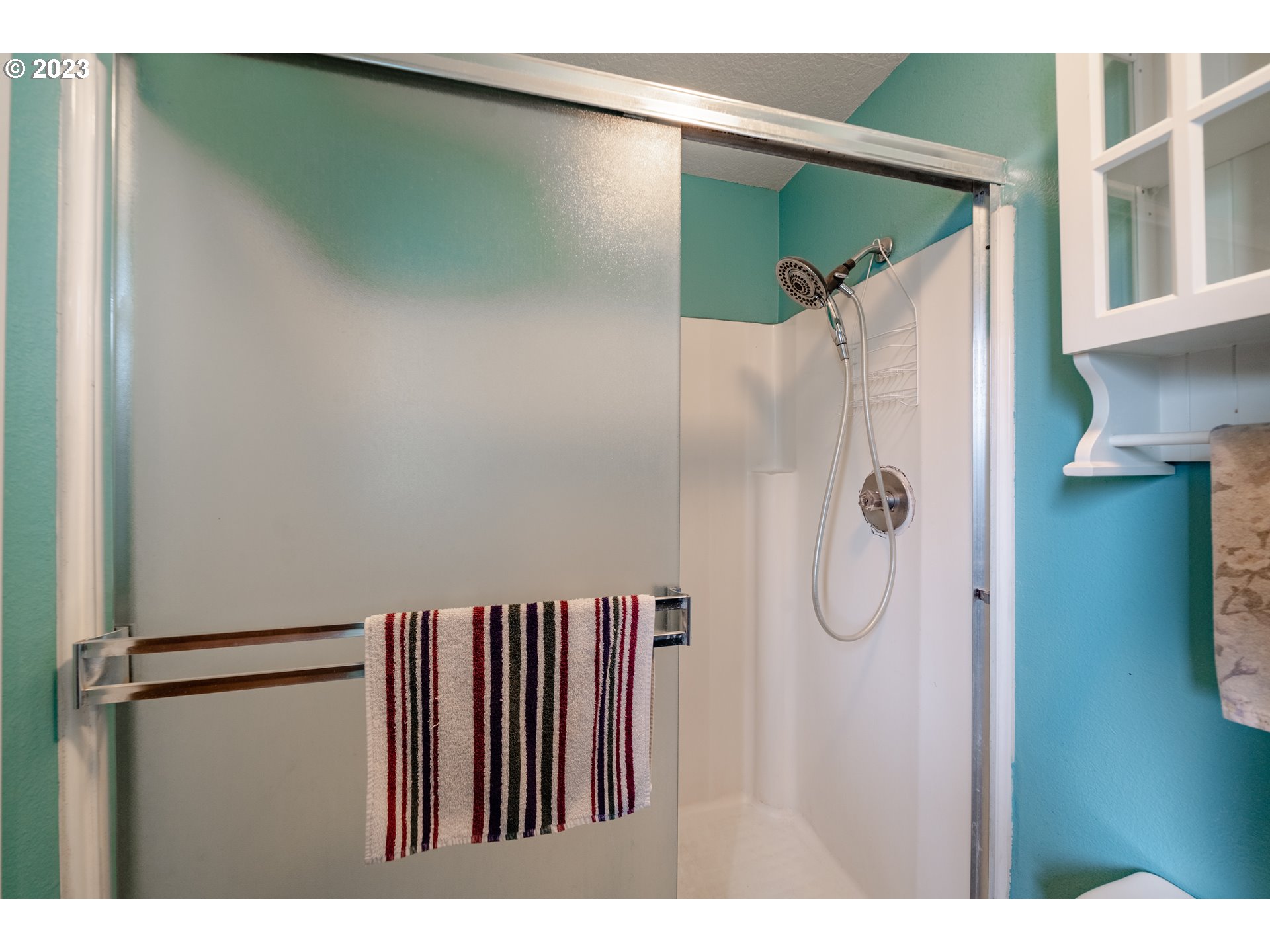 1857 Southwest 5th Street Gresham, OR 97080 - Photo 22 of 40 a bathroom with a shower and a glass door
