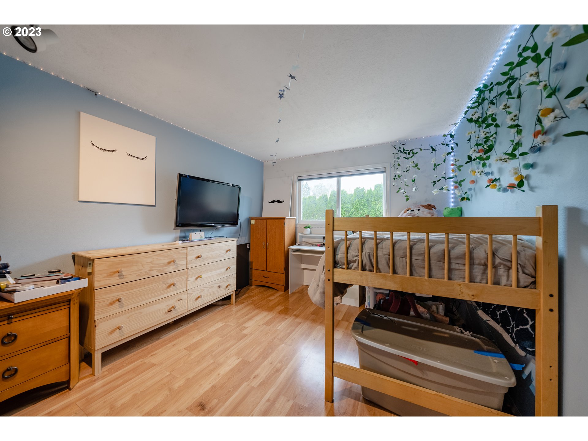 1857 Southwest 5th Street Gresham, OR 97080 - Photo 25 of 40 a bedroom with furniture and a flat screen tv