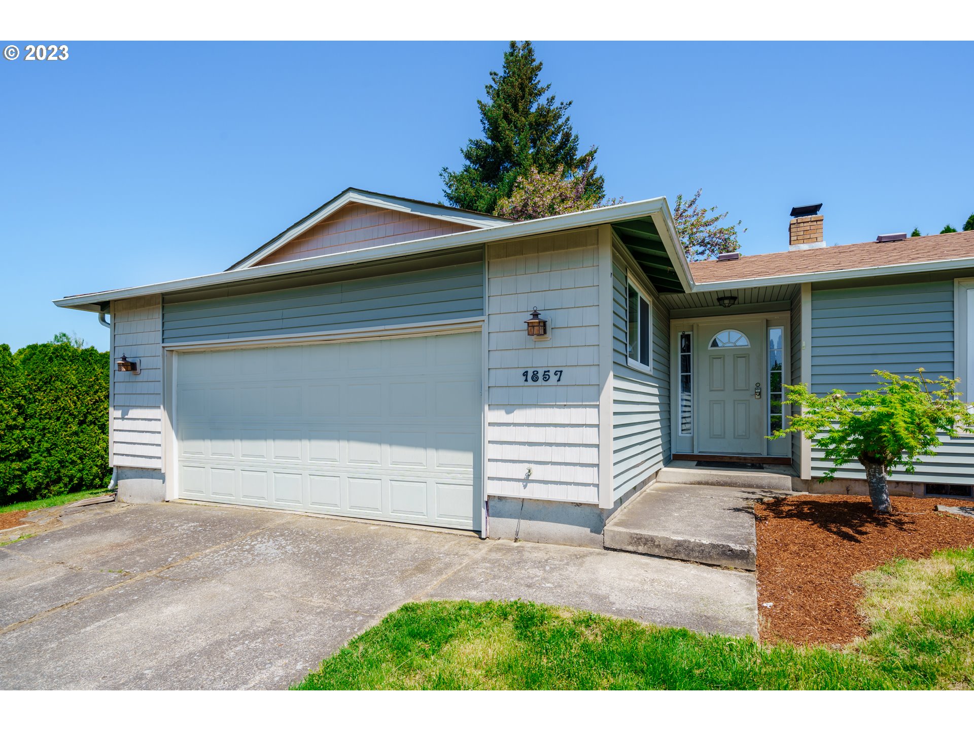 1857 Southwest 5th Street Gresham, OR 97080 - Photo 3 of 40 a front view of a house with garden