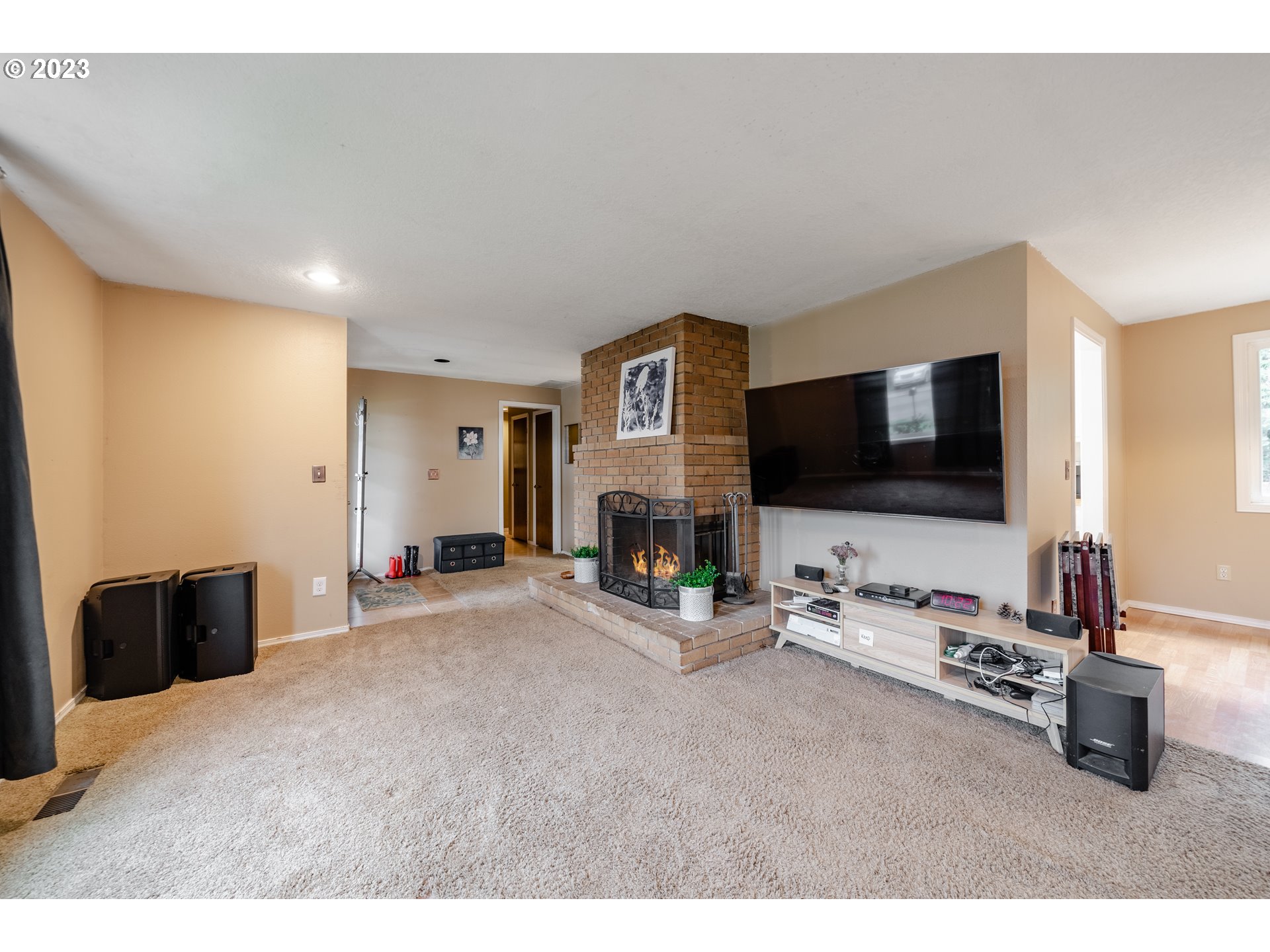 1857 Southwest 5th Street Gresham, OR 97080 - Photo 8 of 40 a living room with furniture flat screen tv and a fireplace