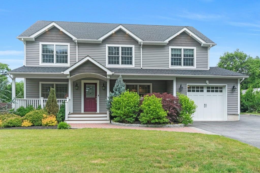 a front view of a house with garden