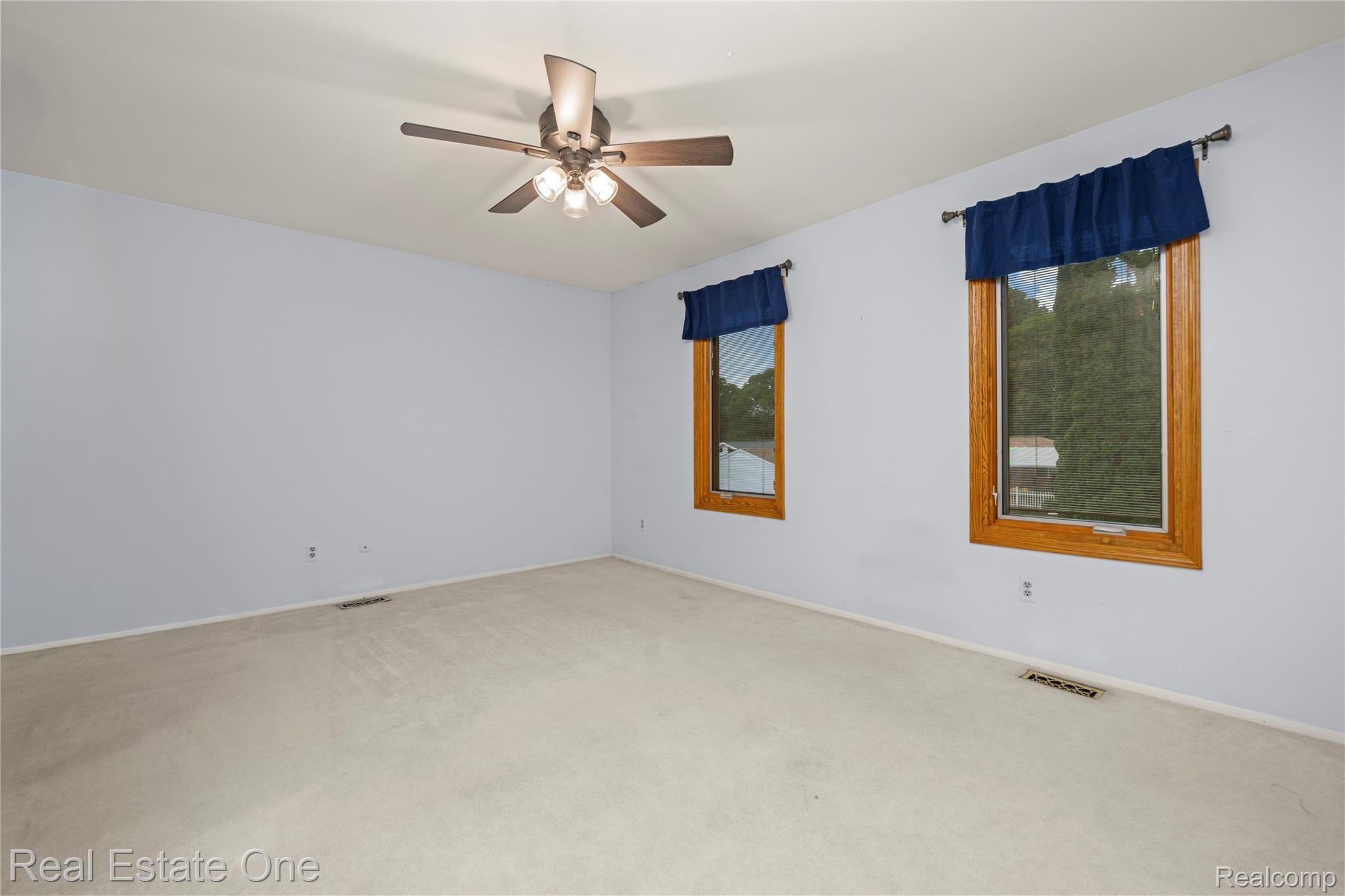 39750 Cheviot Road Canton, MI 48188 - Photo 48 of 71 Recessed lighting, ceiling fan with integrated lighting, wood-framed windows, and carpet flooring