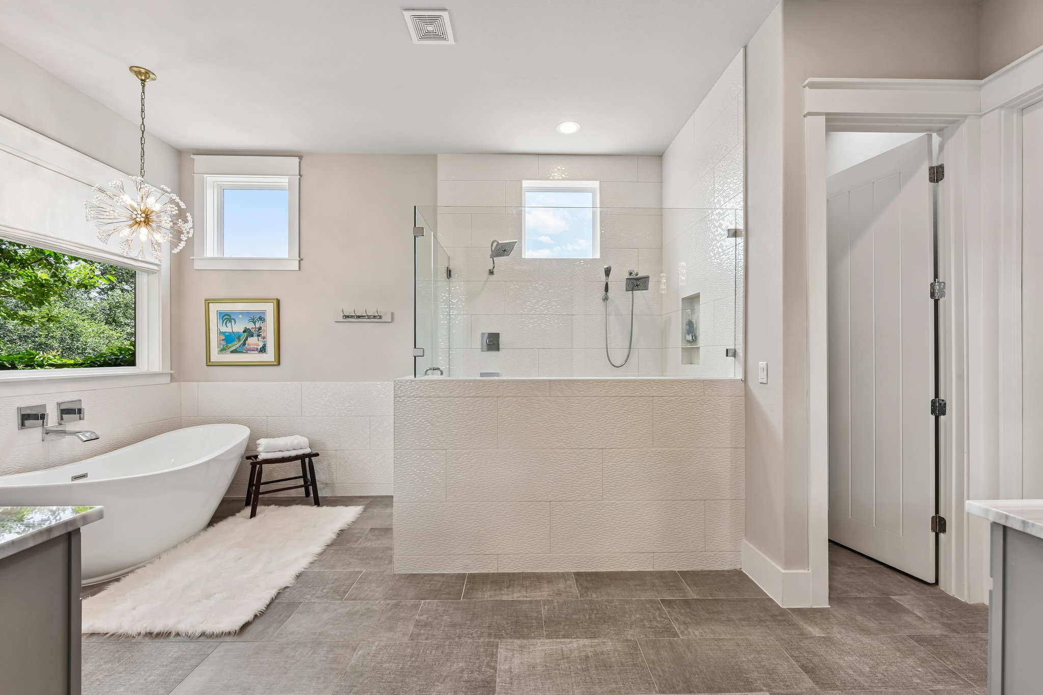 2203 Improver Road Spicewood, TX 78669 - Photo 8 of 38 Luxurious bathroom retreat with a standalone soaking tub and a spacious walk-in shower.
