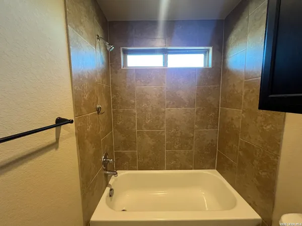 a bathroom with a toilet and a sink