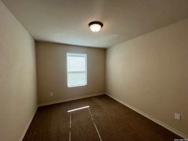 an empty room with a empty space and a window