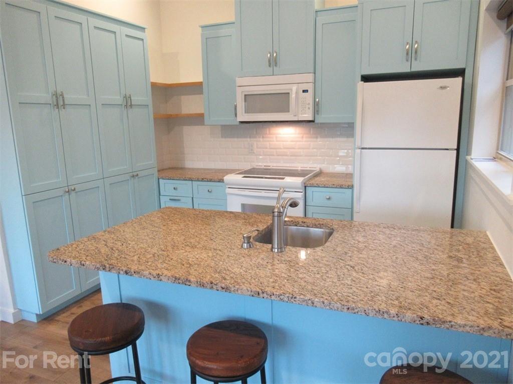 3487 Walker Road, Unit B Maiden, NC 28650 - Photo 9 of 22 a kitchen with a sink a refrigerator and cabinets