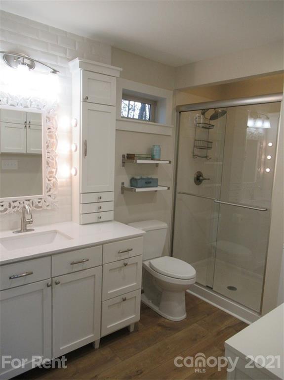 3487 Walker Road, Unit B Maiden, NC 28650 - Photo 10 of 22 a bathroom with a toilet sink and a shower