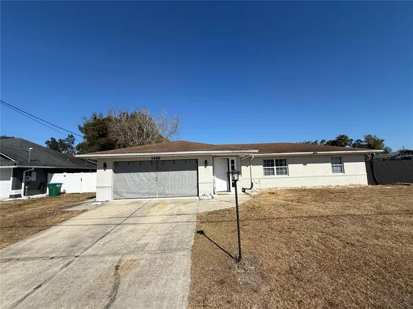a view of house with yard