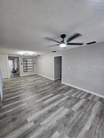 a view of a livingroom with a ceiling fan