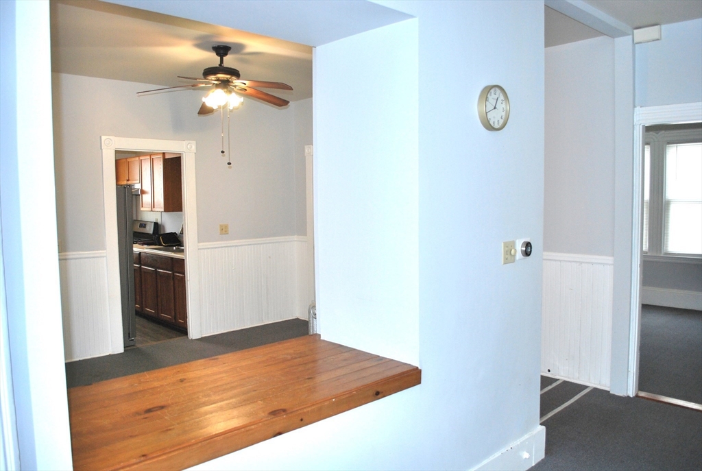 272 Mt Pleasant Street, Unit 2 New Bedford, MA 02746 - Photo 2 of 13 a view of a kitchen cabinets and wooden floor