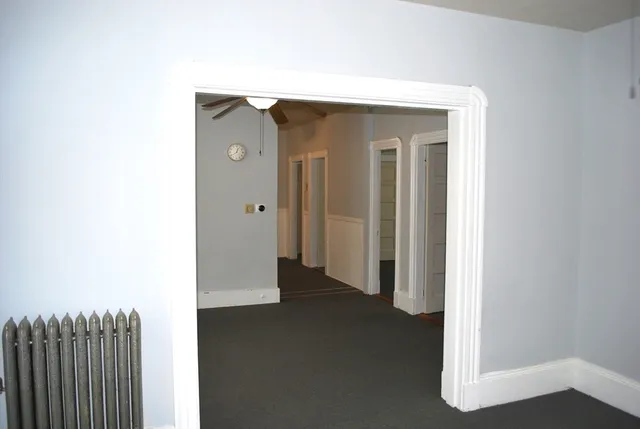 a view of a hallway with closet