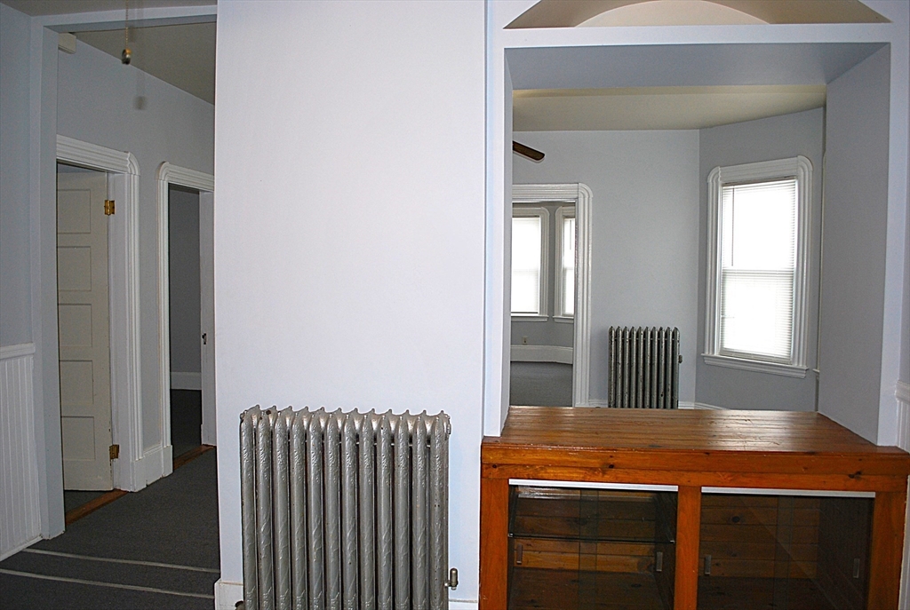 272 Mt Pleasant Street, Unit 2 New Bedford, MA 02746 - Photo 6 of 13 a room with a table and window