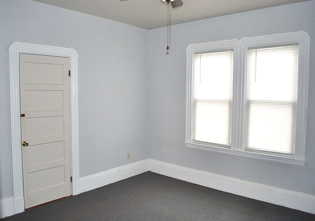 272 Mt Pleasant Street, Unit 2 New Bedford, MA 02746 - Photo 9 of 13 a view of an empty room with a window