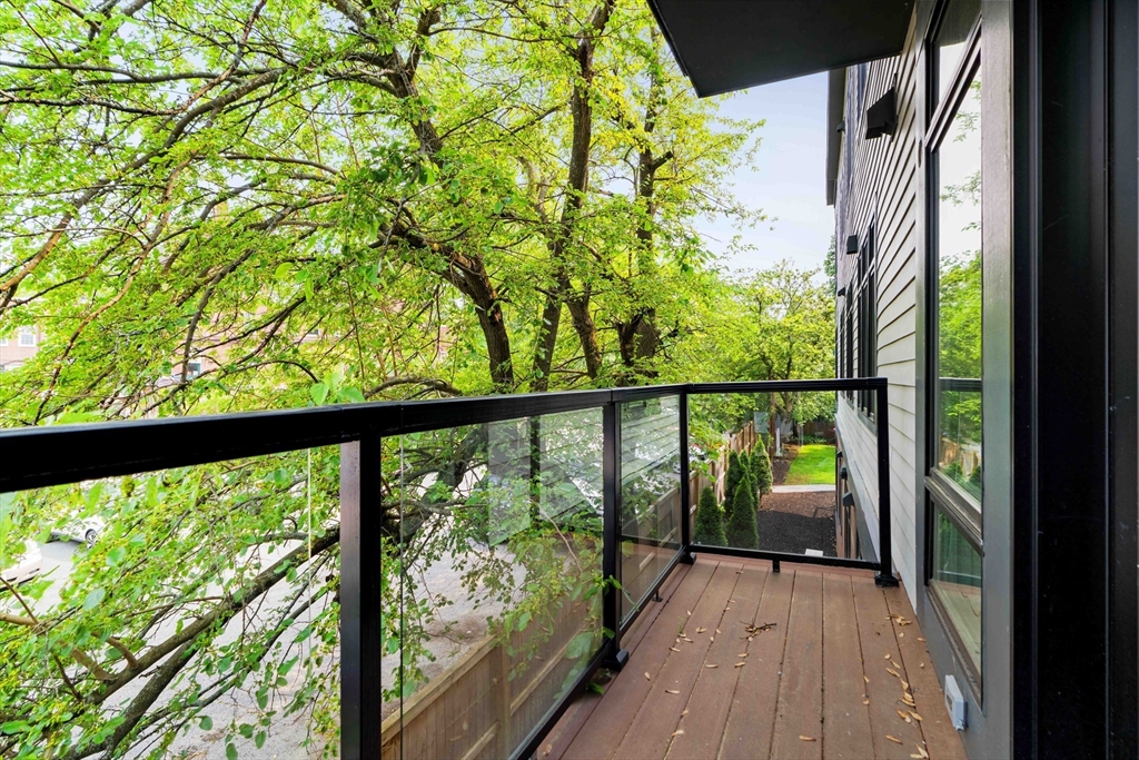 20 Kinmonth Road, Unit 203 Newton, MA 02468 - Photo 18 of 18 a view of balcony with wooden floor