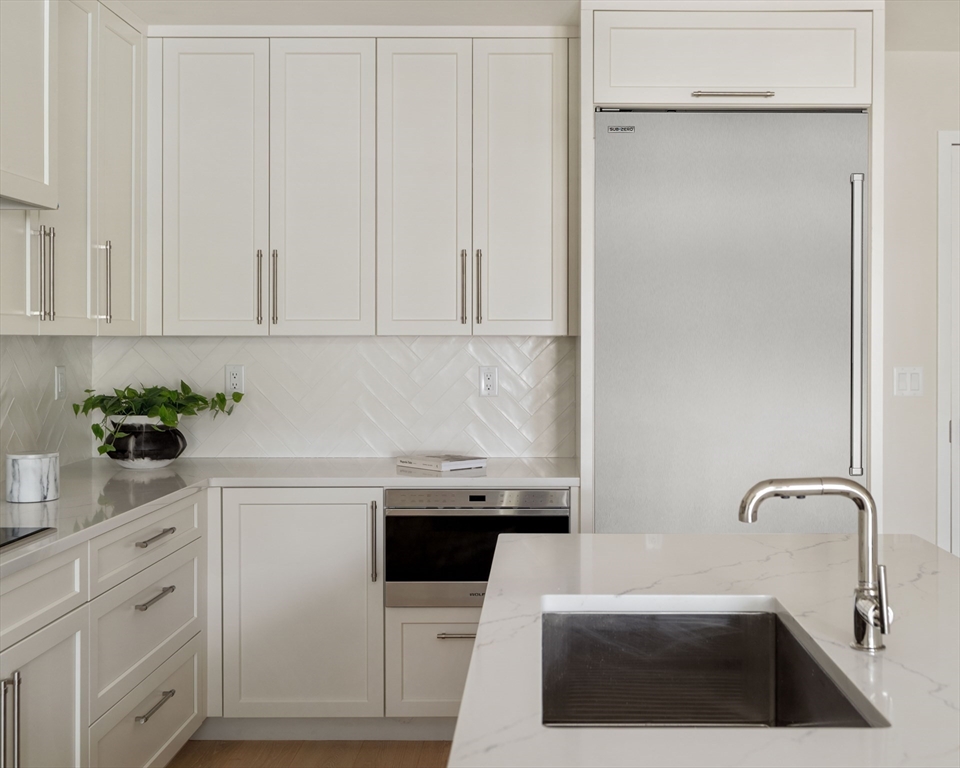 20 Kinmonth Road, Unit 203 Newton, MA 02468 - Photo 5 of 18 a kitchen with a sink and cabinets