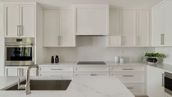 a kitchen with appliances cabinets and a sink