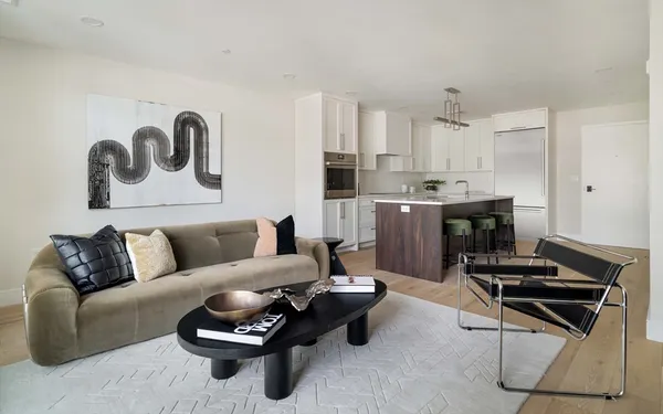 a living room with furniture and a rug