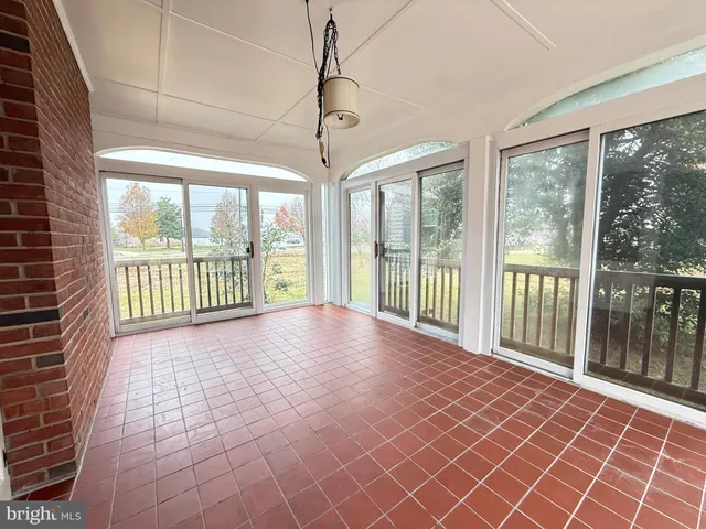 a view of a room with windows