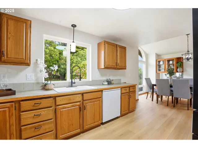 a kitchen with sink and cabinets