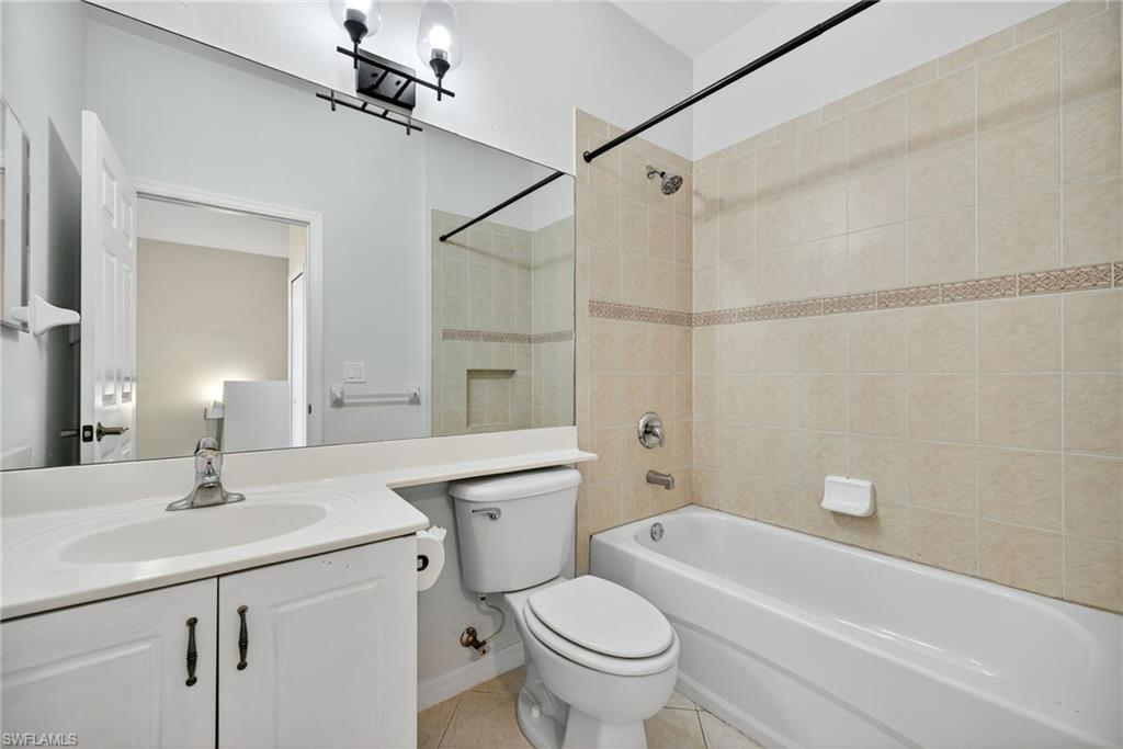 7666 Bristol Circle Naples, FL 34120 - Photo 12 of 20 a bathroom with a sink toilet vanity and shower