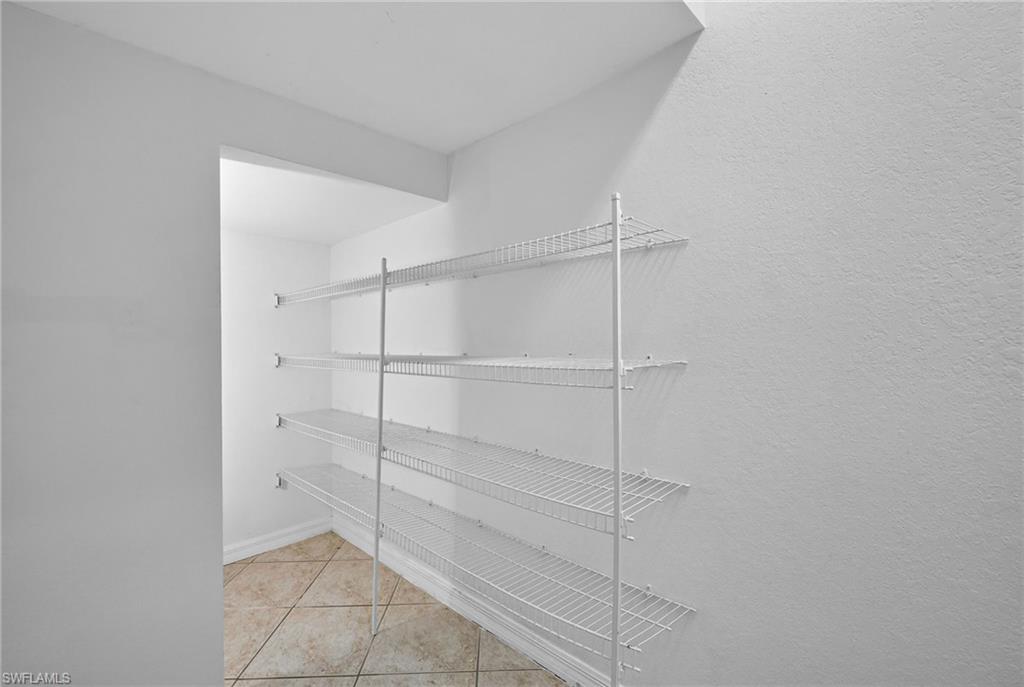 7666 Bristol Circle Naples, FL 34120 - Photo 14 of 20 a room with closet