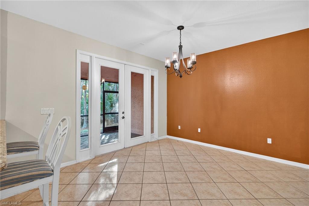 7666 Bristol Circle Naples, FL 34120 - Photo 4 of 20 a view of a room with a chandelier