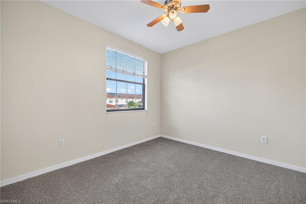 7666 Bristol Circle Naples, FL 34120 - Photo 10 of 20 an empty room with a window