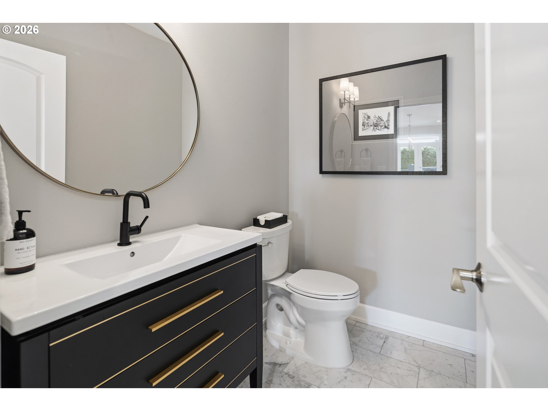 2545 Northwest 12th Circle Camas, WA 98607 - Photo 31 of 46 a bathroom with a sink a toilet and mirror