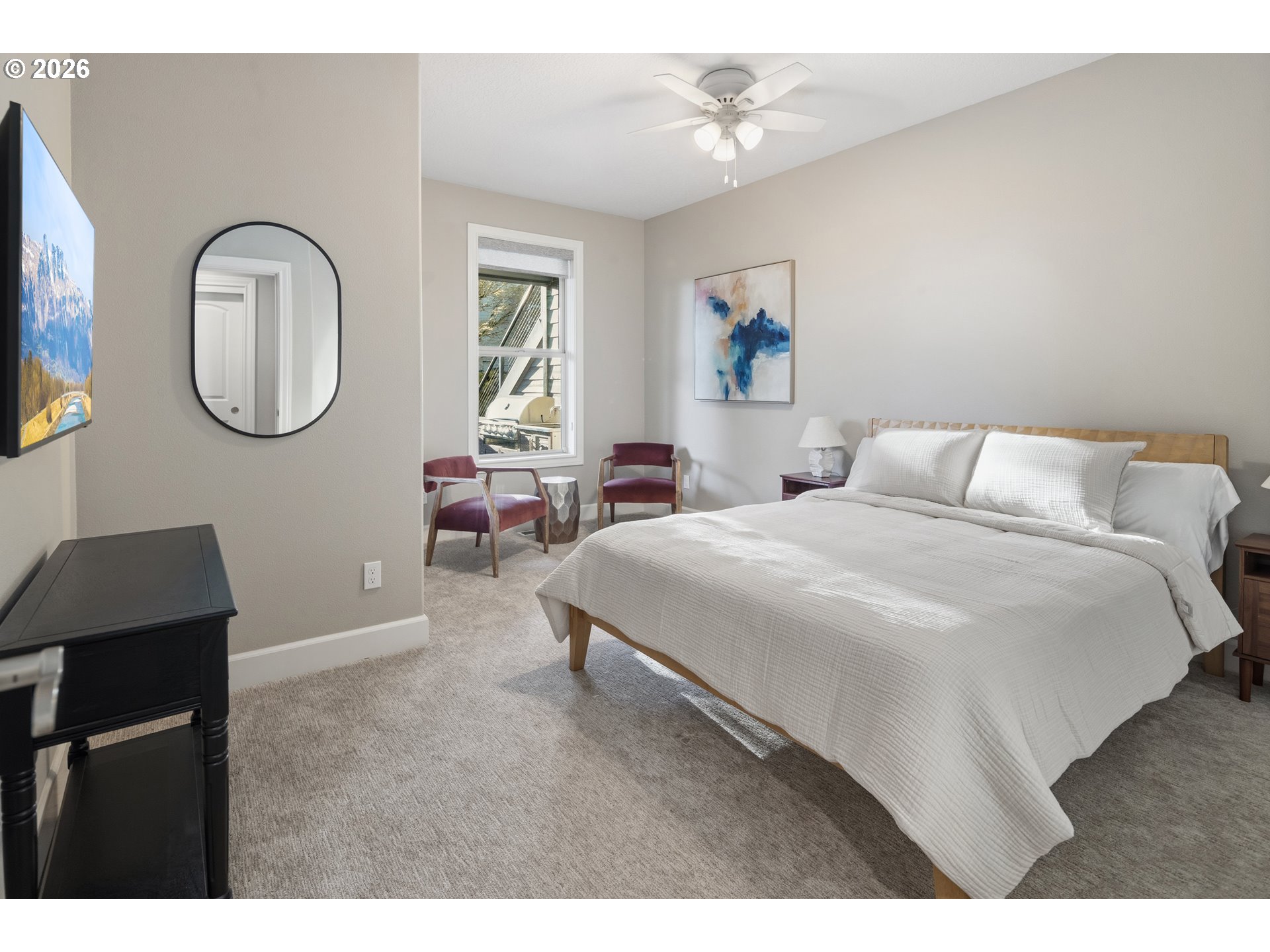 2545 Northwest 12th Circle Camas, WA 98607 - Photo 35 of 46 a bedroom with a large bed and a chandelier