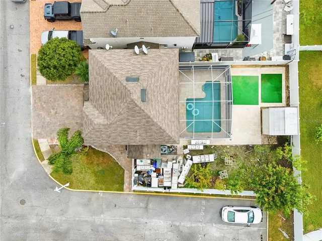 an aerial view of a house with a swimming pool