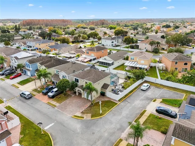 an aerial view of residential houses with outdoor space