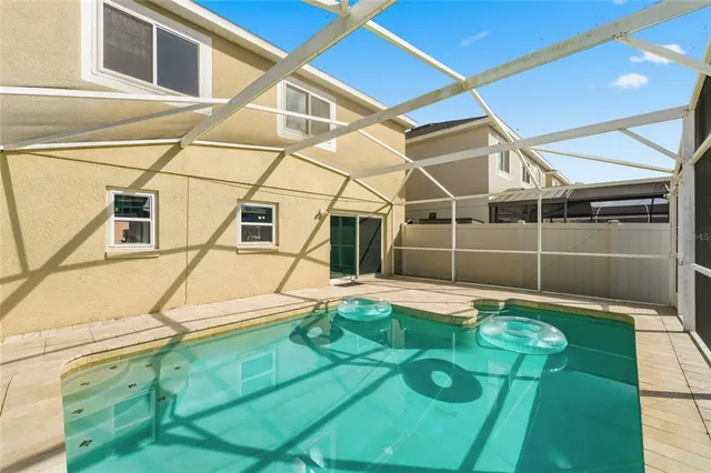 a view of a house with a backyard