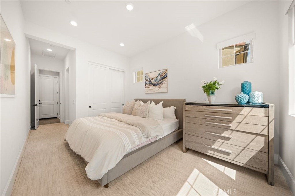 90 Rockinghorse Irvine, CA 92602 - Photo 11 of 30 a bedroom with a bed and a couch