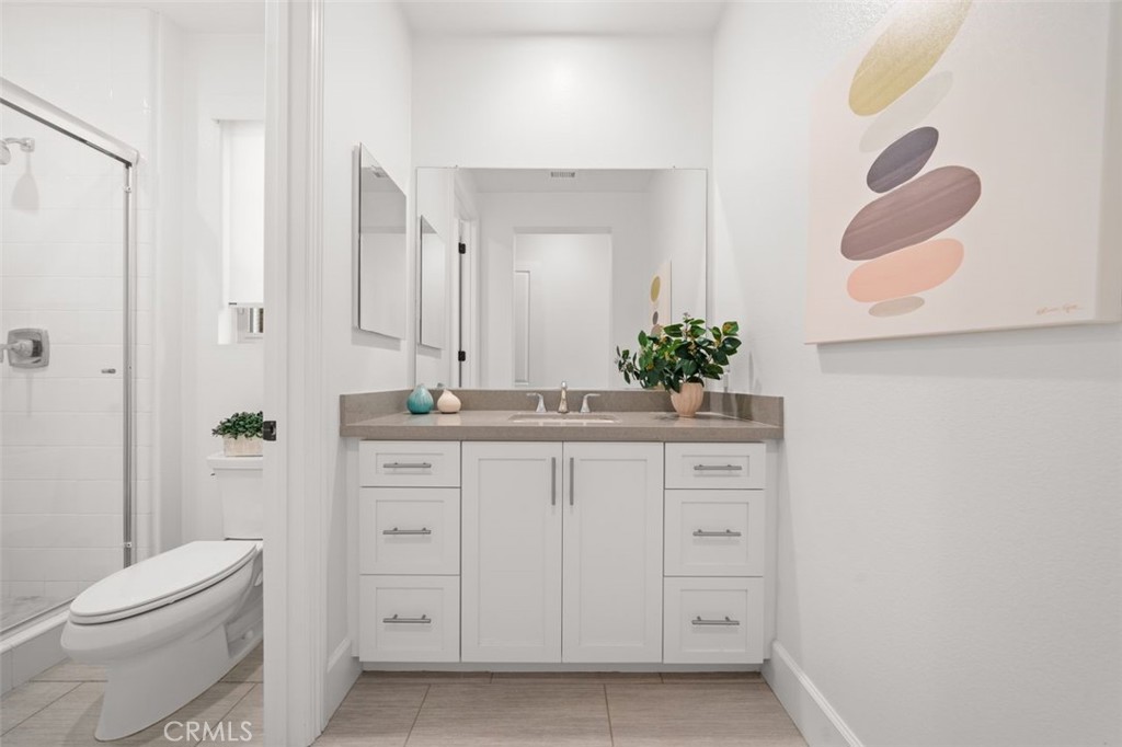90 Rockinghorse Irvine, CA 92602 - Photo 12 of 30 a bathroom with a sink vanity mirror and toilet