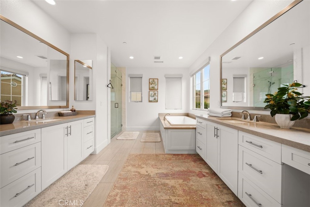 90 Rockinghorse Irvine, CA 92602 - Photo 15 of 30 a large bathroom with a granite countertop sink mirror and a