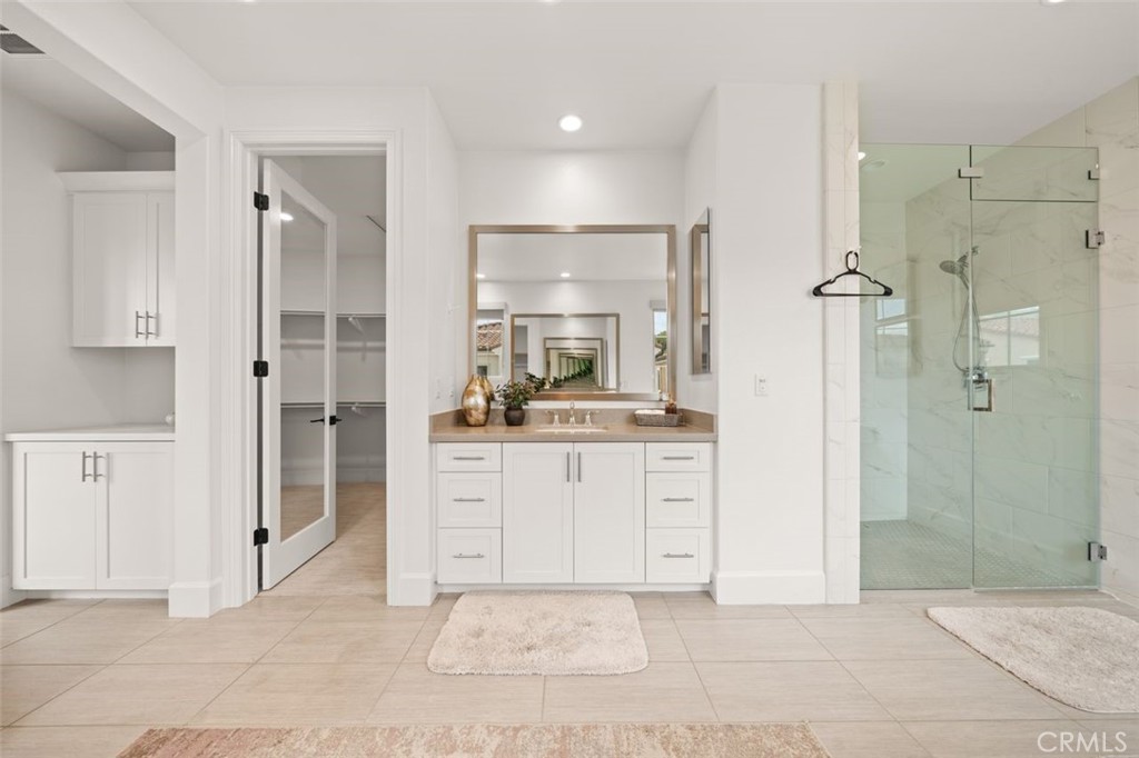 90 Rockinghorse Irvine, CA 92602 - Photo 16 of 30 a bathroom with a sink shower and a mirror