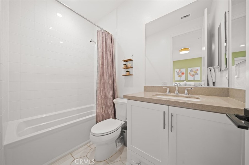 90 Rockinghorse Irvine, CA 92602 - Photo 20 of 30 a bathroom with a granite countertop sink toilet and shower